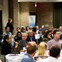 An attendee shares a story and asks a question to the panel.